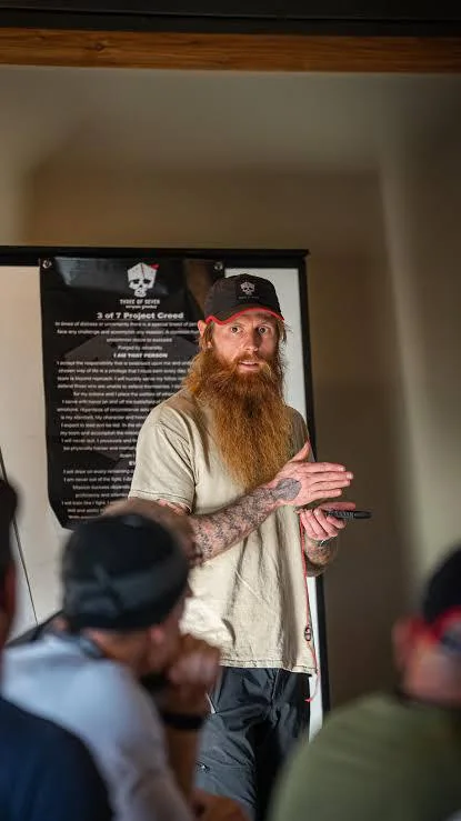 Chadd Wright speaking to a seated classroom group.